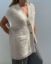 Cardigan smanicato effetto bouclé